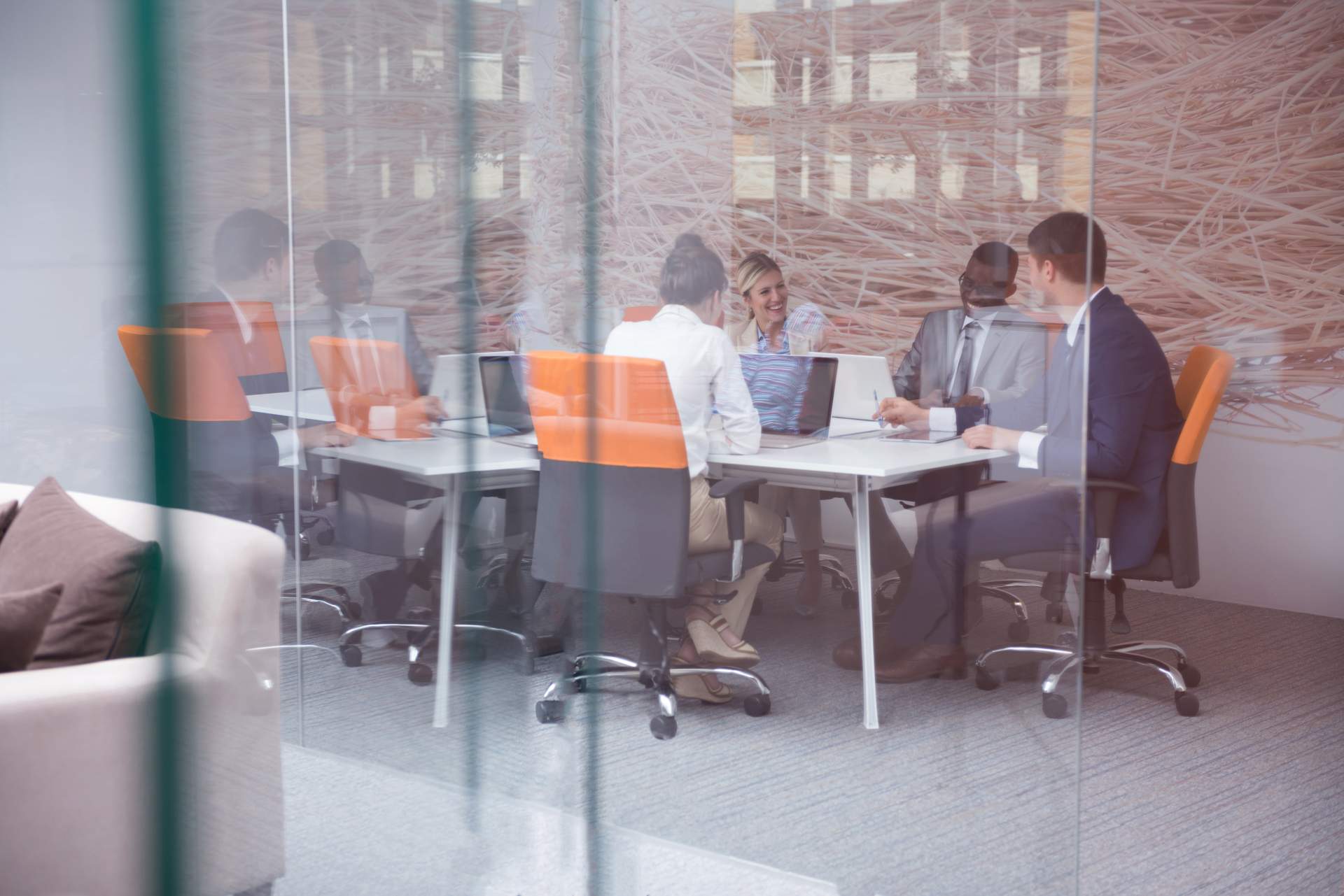 Employees sitting around a conference table in a conference room